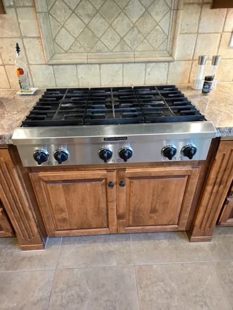 Brand new KitchenAid cooktop installed and ready for use in a modern Elk Grove kitchen.